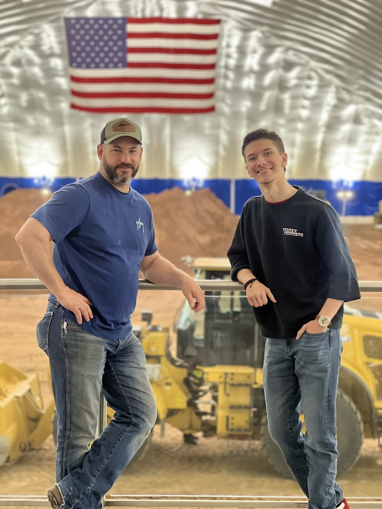 Jason Blackwell and Cooper Kias in a heavy-equipment training facility